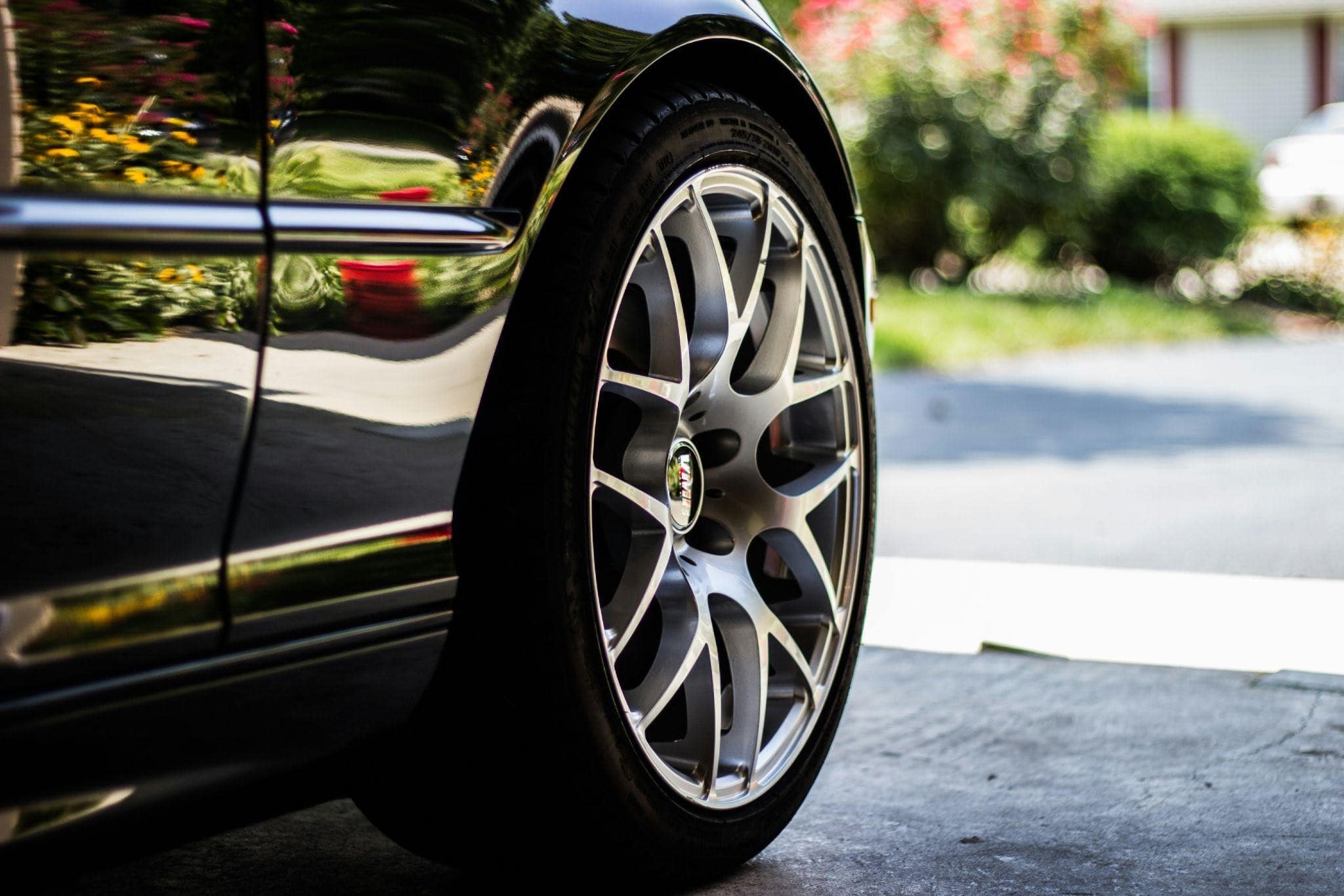 A close up image of a tire and rim of a car